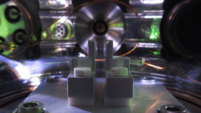 Levitated Nanoparticle Detects Single-Atom Collisions