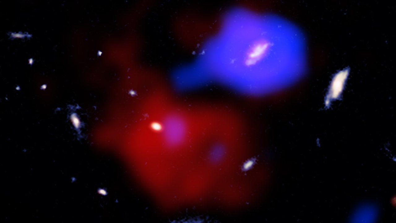 X-ray spacecraft reveals supermassive black hole stirring gas in 'red potato' galaxy